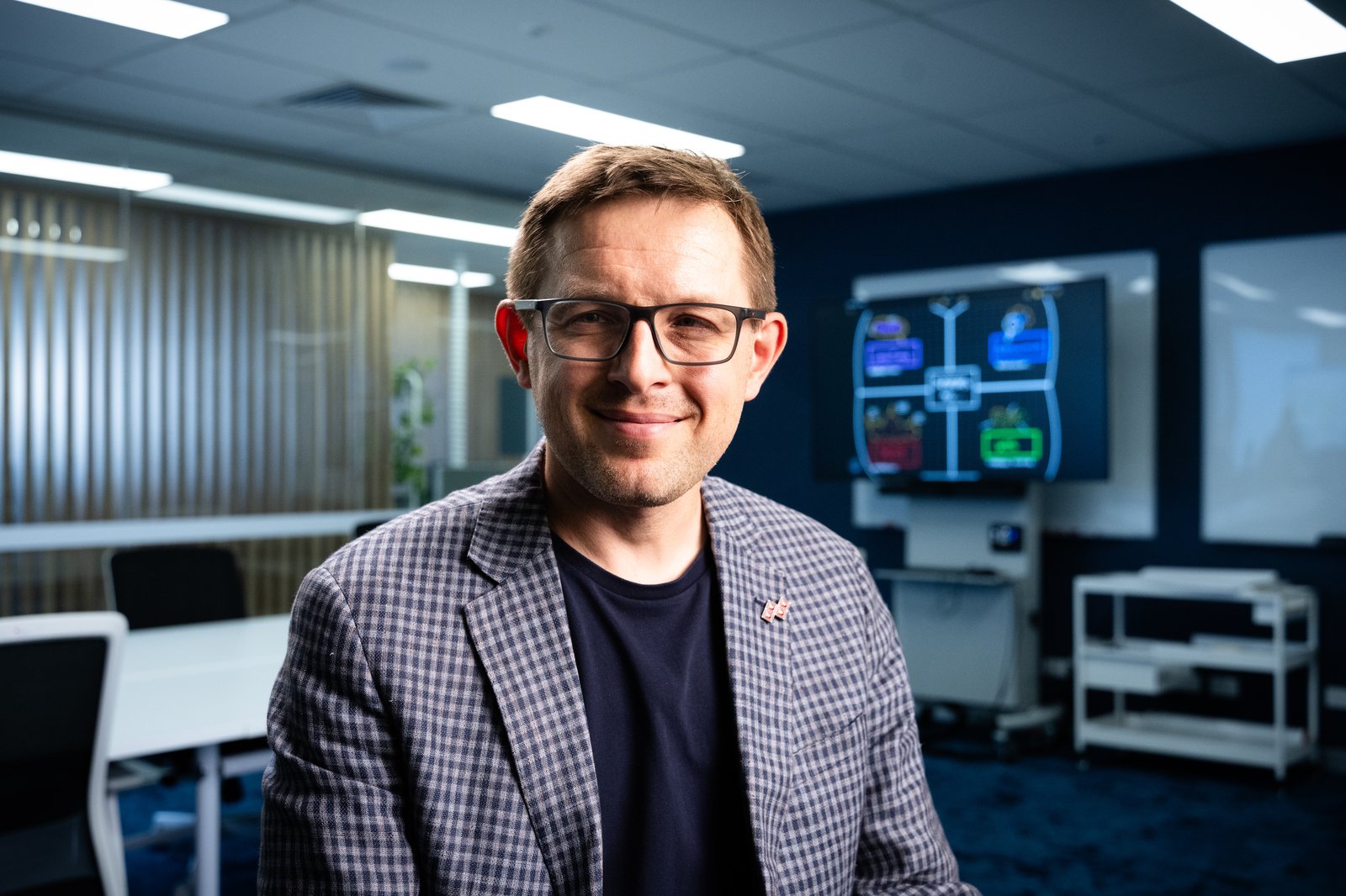 Professor Marek Kowalkiewicz in the QUT Digital Economy lab
